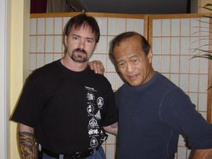 Mark with Dan Inosanto while directing his daughter, Diana, in Sensei